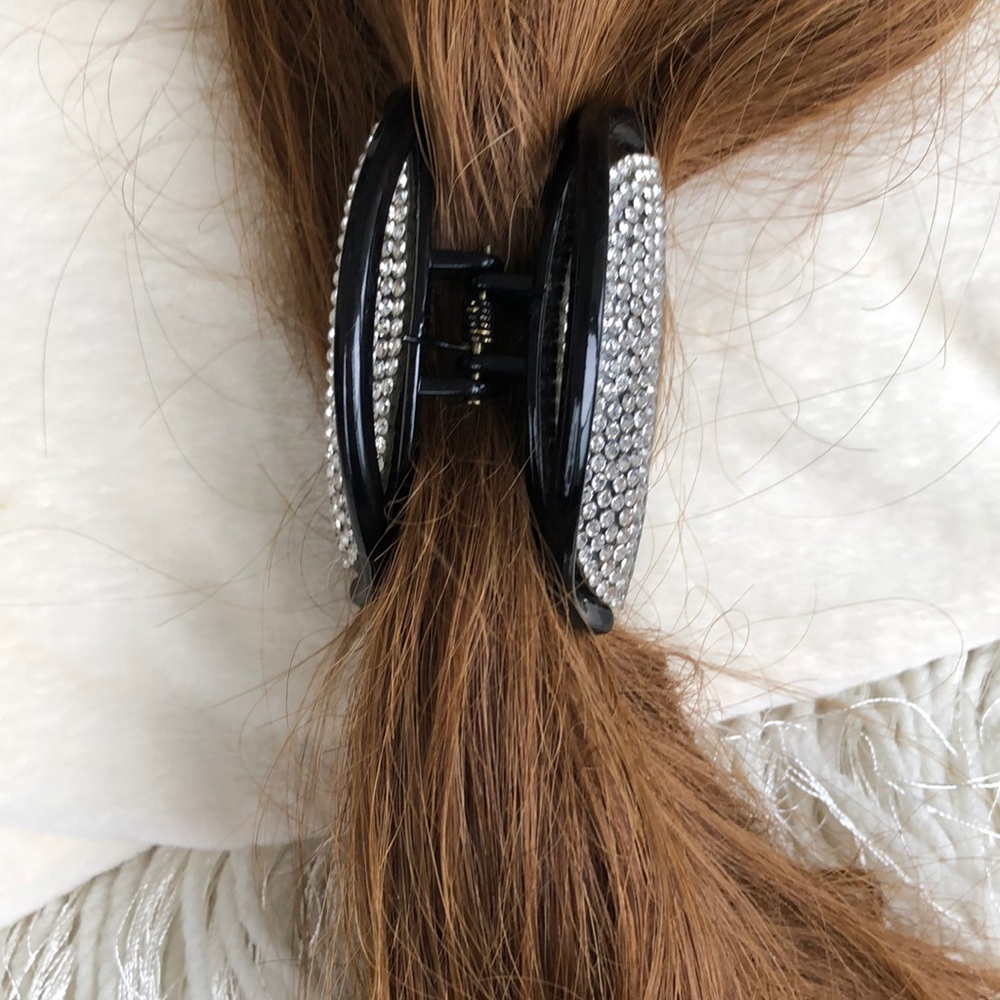 RHINESTONE CLIP ON BLACK BACKGROUND